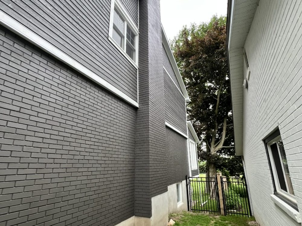 Exterior repaint on dark siding