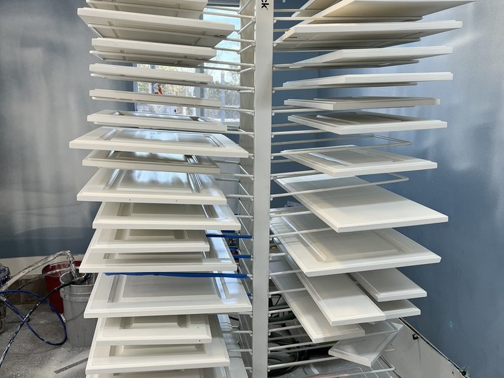 Kitchen cabinet doors on drying racks