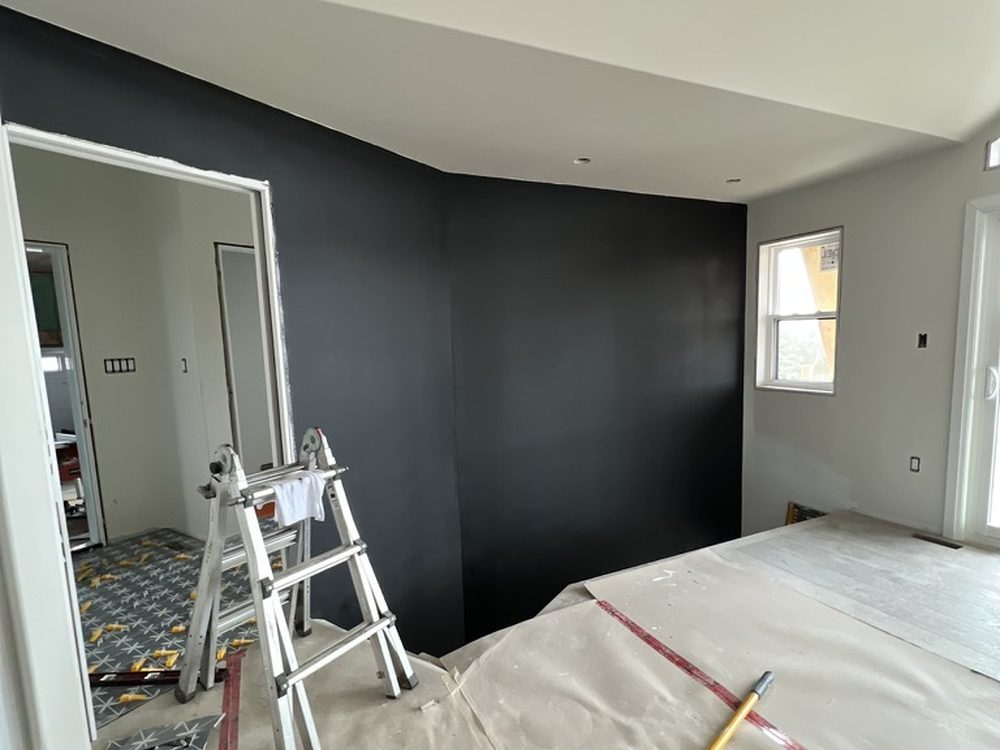 Bedroom with black accent wall