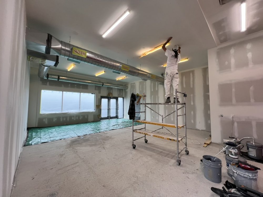 Commercial interior painting from a lift